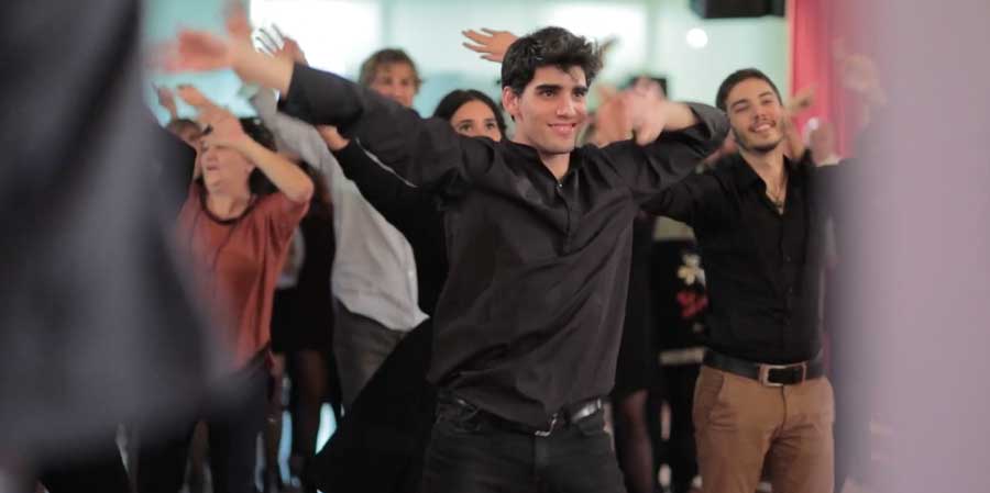 Professional dancers teaching easy steps to guests during an interactive flash mob