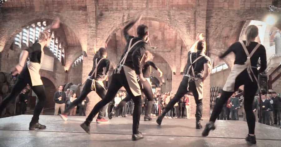 Undercover dancers performing a surprise flash mob at a corporate event